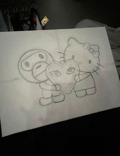 a drawing of hello kitty and her sister