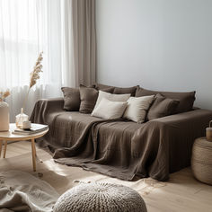 a living room filled with furniture and pillows