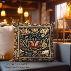 a decorative pillow sitting on top of a couch