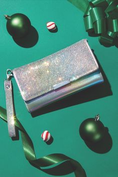 A touch of glam for every outfit. ✨ Make her holiday extra bright with this Holographic Crystal Crossbody Wristlet Wallet from Claire's! 💎