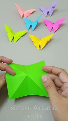 origami butterflies being folded in different colors