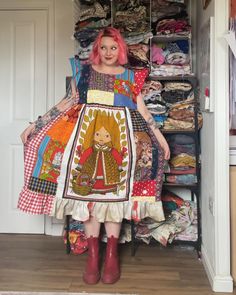 a woman standing in front of a closet full of clothes