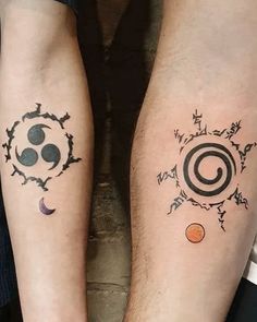 two people with tattoos on their legs and one has a sun, moon and stars