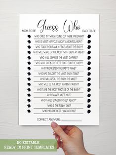 a hand holding up a printable guess who game with the words guess who?