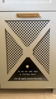 a close up of a metal object with words on it and an image of a cat