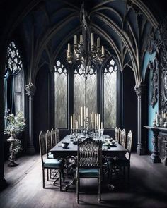 a dining room table and chairs with candles on them in front of large arched windows