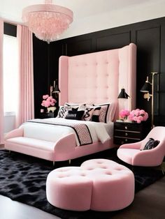 a bedroom with black walls, pink bedding and chandelier