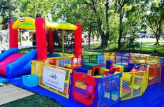 an inflatable play area with slides and bouncers for children to play on