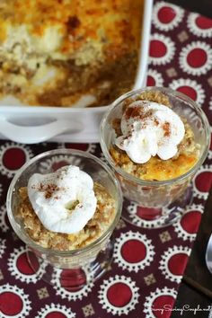 three desserts in small glass dishes on a table