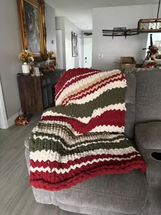 a couch with a blanket on top of it