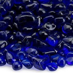 blue glass beads are stacked on top of each other