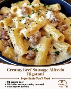 a blue bowl filled with pasta covered in cheese and meat sauce next to a sign that says creamy beef sausage alfredo