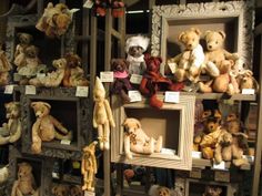 there are many stuffed animals on display in the store