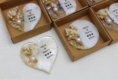 four boxes filled with different types of jewelry