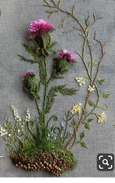 some flowers and plants are sitting on a gray table cloth with the words, what do you think?