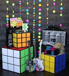 a group of toys sitting on top of each other in front of a chalkboard