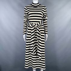 Marc Jacobs Runway Dress In A Black And White Wool Nylon Blend Knit Fabric Featuring A Horizontal Stripe Pattern, Extra Long Sleeves, And Invisible Back Zipper Closure. Made In Usa.Very Good Pre-Owned Condition. Minor Signs Of Wear. Marked: 6 Measurements: Shoulder: 16 Inches Bust: 35 Inches Waist: 29 Inches Hip: 50 Inches Length: 48 Inches Sui Generis Reference: 130690 Category: Dress More Details Brand: Marc Jacobs Gender: Female Size: 6 Color: Black Color 2: White Fabric: Wool / Nylon Pattern Marc Jacobs Runway, Black And White Striped Dress, Marc Jacobs Dress, Runway Dresses, Extra Long Sleeves, Jacob Black, White Striped Dress, Color 2, White Fabric