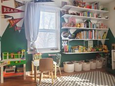 a child's room with bookshelves and toys on the shelves in it