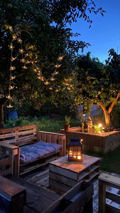 an outdoor seating area is lit up at night