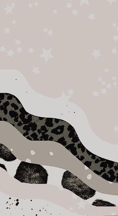 a black and white snake laying on top of a snow covered ground with stars in the background