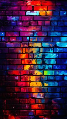 a brick wall painted with multicolored paint