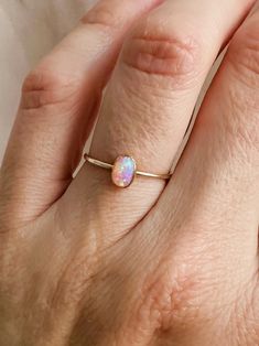 Indulge in the beauty of this stunning Pink Opal Cocktail Ring, a unique and elegant piece perfect for any occasion. Handcrafted with care, this ring features a vibrant pink opal gemstone set in high-quality sterling silver, creating a timeless look that's both bold and sophisticated. This ring is more than just jewelry; it's an eye-catching statement piece that adds a touch of luxury to your style. Details: *14K gold filled & sterling silver *band: hammered style *Gemstone: Pink fire opal *meas Dainty Opal Ring, Opal Meaning, Pink Opal Ring, Pink Fire, Opal Ring Gold, Fire Opal Ring, Jewelry Care Instructions, Statement Ring Silver, Gold Filled Ring