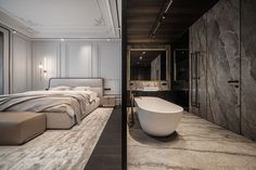 a bathroom with a bathtub, sink and large bed in it's center