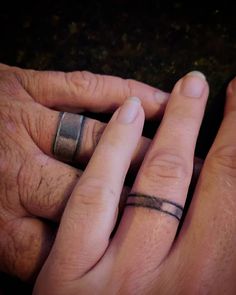 two people with wedding rings on their fingers