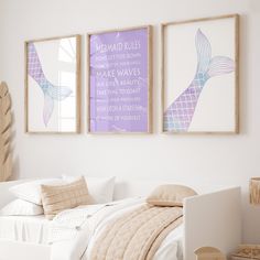 two framed pictures hang on the wall above a bed in a room with white walls