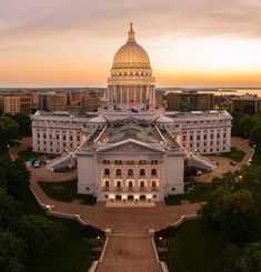 an aerial view of the state capitol building in washington, d c at sunset or dawn