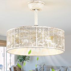 a chandelier hanging from the ceiling in a living room