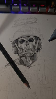 a pencil drawing of a skull wearing a helmet and holding a knife next to a computer keyboard