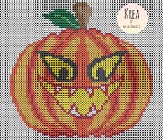 a cross stitch pumpkin with a smile on it's face and the words krea written