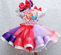 a dress made out of tulle and ribbon with paw patrol on the front,