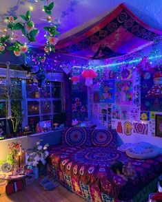 a bedroom decorated in bright colors with lights on the ceiling and decorations hanging from the ceiling