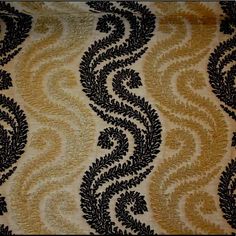 a black and gold fabric with an intricate design