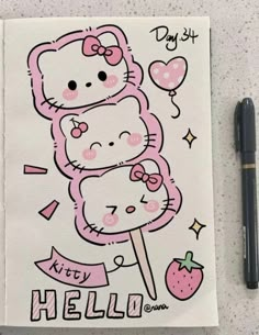 a hello kitty sticker next to a pen on a paper with the words hello kitty