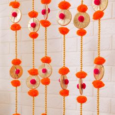 marigold pompom garlnads Diwali Pooja Decoration, Indian Backdrop, Entryway Doors, Toran Designs, Pompom Balls, Diwali Ideas, Diwali Candles, Diwali Pooja, Pooja Decoration