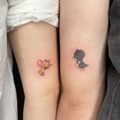 two people with matching tattoos on their legs, one has a teddy bear and the other has a balloon