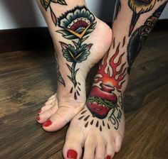 two feet with tattoos on them, one is red and the other has yellow flowers