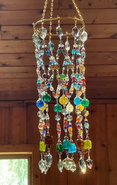 a chandelier hanging from a wooden ceiling