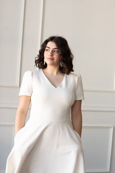 Our Kate fit-and-flare dress provides a blank canvas to showcase your bridal style at any of your wedding events. And did we mention there’s pockets?! You’ll thank us later. This is a classic piece that you can re-style well after the wedding. Puffed short sleeves. Paneled skirt. Pockets. Hidden back zipper enclosure. Sale items are final sale and not eligible for return. After The Wedding, Skirt Pockets, Paneled Skirt, Gal Meets Glam, Glam Dresses, Blank Canvas, Fit And Flare Dress, Bridal Style, Flare Dress