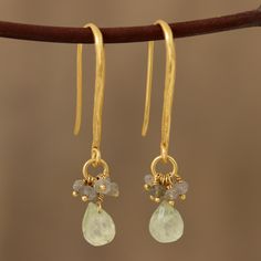 As fascinating as they are glamorous, these Indian earrings feature clusters of petite labradorite gems that dangle above drops of prehnite. Designed by Vivek Nathany, these earrings swing from long, hammered hooks of sterling silver bathed in 22k gold. Indian Earrings, Silver Art, Amethyst Earrings, Cluster Earrings, Jewelry Online Shopping, Jewelry Packaging, Gold Plated Earrings, Leaf Earrings, 22k Gold