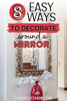 a red vase sitting on top of a table in front of a mirror with the words 8 easy ways to decorate around a mirror