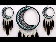 three pieces of jewelry are hanging on a wall next to two hoops with beads and tassels