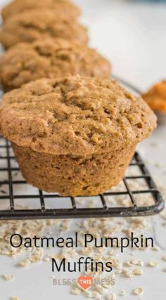 several muffins cooling on a wire rack with oatmeal in the background