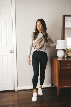 ashley wearing a gray tee, olive green belt bag, black leggings, and white sneakers standing next to a vintage wood dresser with a white table lamp Mini Capsule Wardrobe, Winter Look Book, Outfits Leggins, Mom Outfits Fall, Walking Outfits, Outfits For Work, Moda Chic, Fall Mini, Fall Capsule Wardrobe