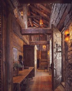 the interior of a rustic cabin with wooden walls and ceilings