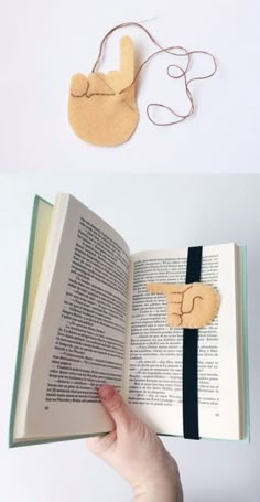 an open book with a wooden cut out of it