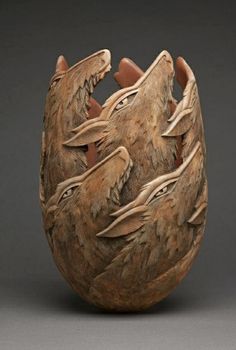 an egg with three birds carved into it